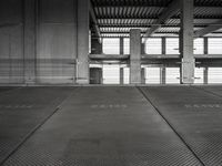 empty garage with no one on it, black and white photo by mark ebersel