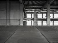 empty garage with no one on it, black and white photo by mark ebersel