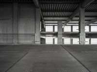 empty garage with no one on it, black and white photo by mark ebersel