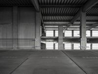 empty garage with no one on it, black and white photo by mark ebersel