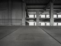 empty garage with no one on it, black and white photo by mark ebersel