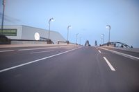an empty highway with several cars passing by on either side and on the other side