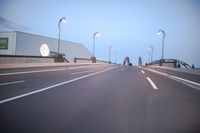 an empty highway with several cars passing by on either side and on the other side
