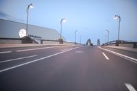an empty highway with several cars passing by on either side and on the other side