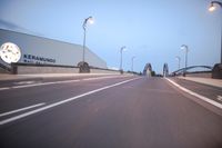 an empty highway with several cars passing by on either side and on the other side