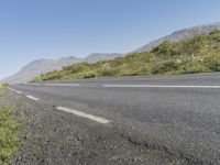 the highway in the mountains is empty and empty of cars or motorcycles in it,