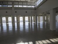 a large empty industrial building has been cleaned and stained with yellow paint and flooring