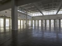 a large empty industrial building has been cleaned and stained with yellow paint and flooring