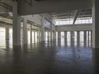 a large empty industrial building has been cleaned and stained with yellow paint and flooring