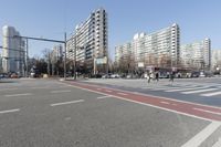 the intersection at a busy city street is empty of cars and pedestrians to cross the street