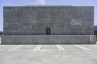 there is an empty parking lot with no one in it as shown, and is gray