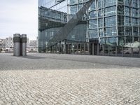 this is an image of an area in front of some modern buildings that is very empty