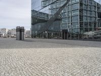 this is an image of an area in front of some modern buildings that is very empty