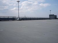 a boat is parked in an empty parking lot near an air port on the water