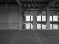 an empty parking garage with two parking spaces on each side of it and no cars