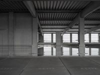 an empty parking garage with two parking spaces on each side of it and no cars