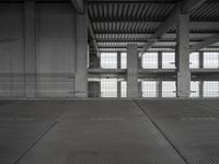 an empty parking garage with two parking spaces on each side of it and no cars