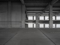 an empty parking garage with two parking spaces on each side of it and no cars