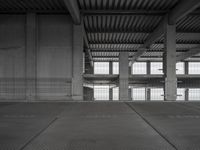 an empty parking garage with two parking spaces on each side of it and no cars