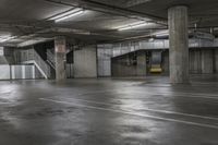an empty parking garage with stairs and concrete walls is pictured in this image taken in daylight