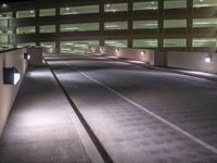 a view of a road and an overpass with traffic passing through it by buildings