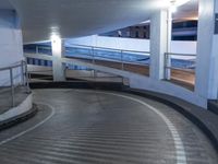 an empty and empty parking garage with stairs up to the ceiling from the bottom of the walkway