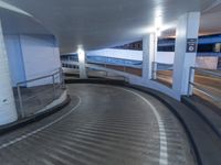 an empty and empty parking garage with stairs up to the ceiling from the bottom of the walkway