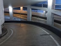 an empty and empty parking garage with stairs up to the ceiling from the bottom of the walkway