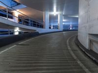 an empty and empty parking garage with stairs up to the ceiling from the bottom of the walkway