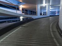 an empty and empty parking garage with stairs up to the ceiling from the bottom of the walkway