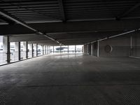 an empty parking garage has been transformed into a tunnel for pedestrians to use as a car park