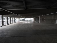 an empty parking garage has been transformed into a tunnel for pedestrians to use as a car park