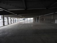 an empty parking garage has been transformed into a tunnel for pedestrians to use as a car park