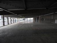 an empty parking garage has been transformed into a tunnel for pedestrians to use as a car park