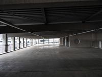 an empty parking garage has been transformed into a tunnel for pedestrians to use as a car park