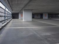 the empty parking garage of an unfinished building, has numbered numbers 3 - 8 on it