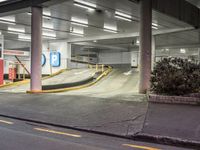 a parking garage with an empty street and several barriers surrounding it, with a sign that says not on