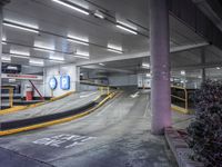 a parking garage with an empty street and several barriers surrounding it, with a sign that says not on