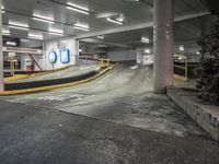 a parking garage with an empty street and several barriers surrounding it, with a sign that says not on