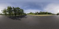 an image of an empty parking lot for cars to drive in it is a wide angle