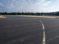 an empty parking lot with no grass or cars parked on it at the airport is ready for some change