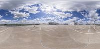 an angle view of a very wide empty parking lot as seen through a fish eye lens