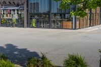 the empty parking lot near a bike store in urban area with sun shining through windows