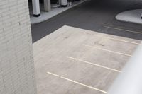 a view of the empty parking lot with cars parked in it's parking spaces