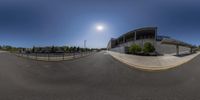 a fisheye image shows how the intersection of an empty parking lot is defined by a curved wall