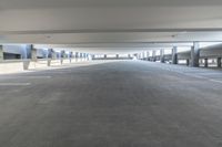 a picture of an empty parking lot in the daytime or the day light is on