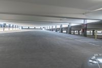 a picture of an empty parking lot in the daytime or the day light is on