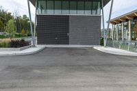 the empty parking lot has a small fire hydrant on it's side in a public park