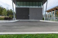 the empty parking lot has a small fire hydrant on it's side in a public park