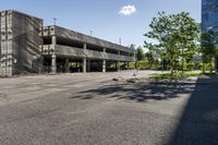 a view of the empty parking lot outside of a building with no people on it